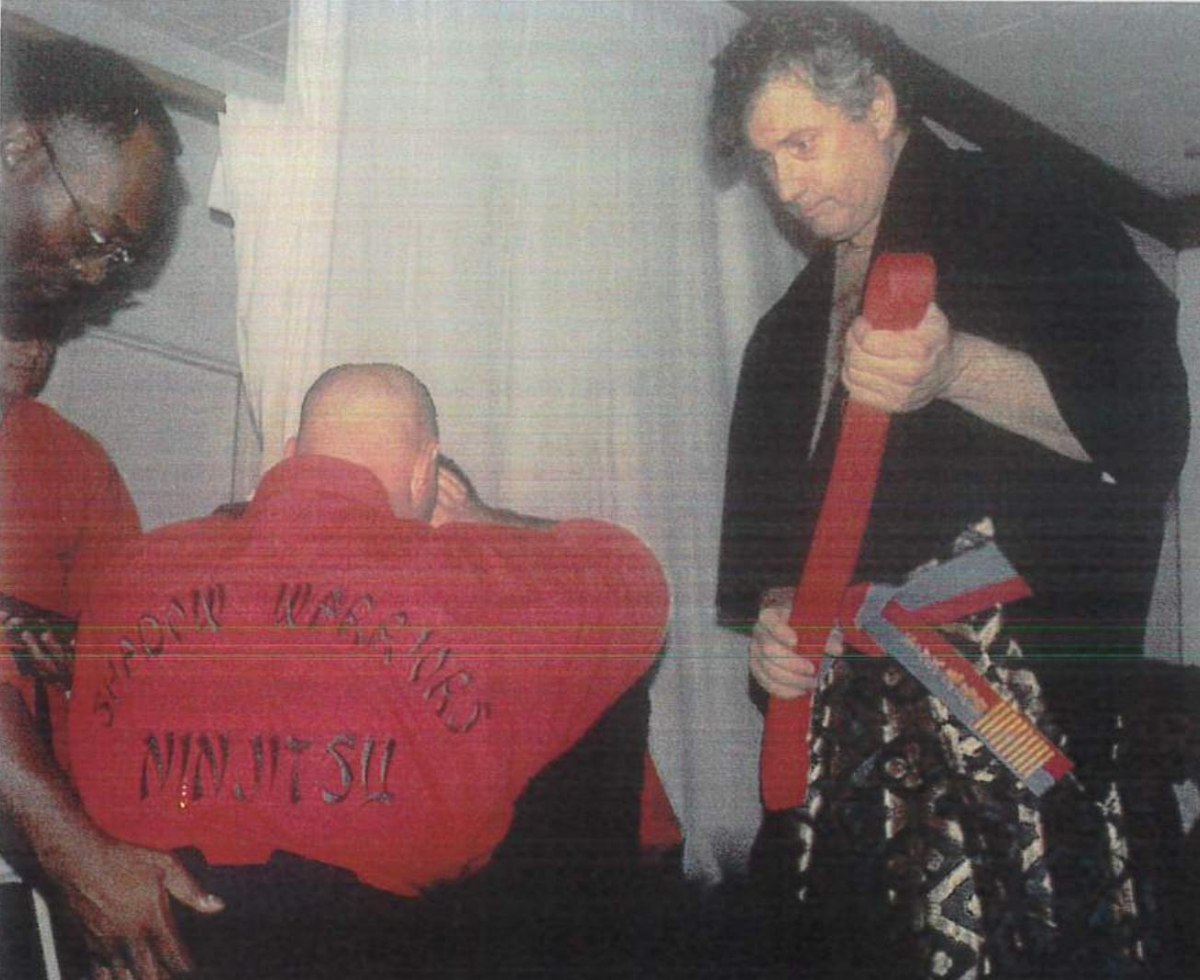 Steven Williams sharing a moment with a student at a belt ceremony