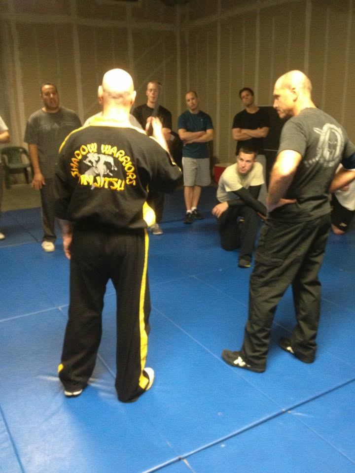 Instructor demonstrating for a circle of students