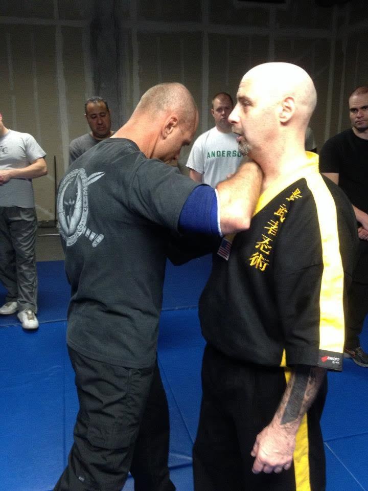 Instructors demonstrating a close-quarter control technique